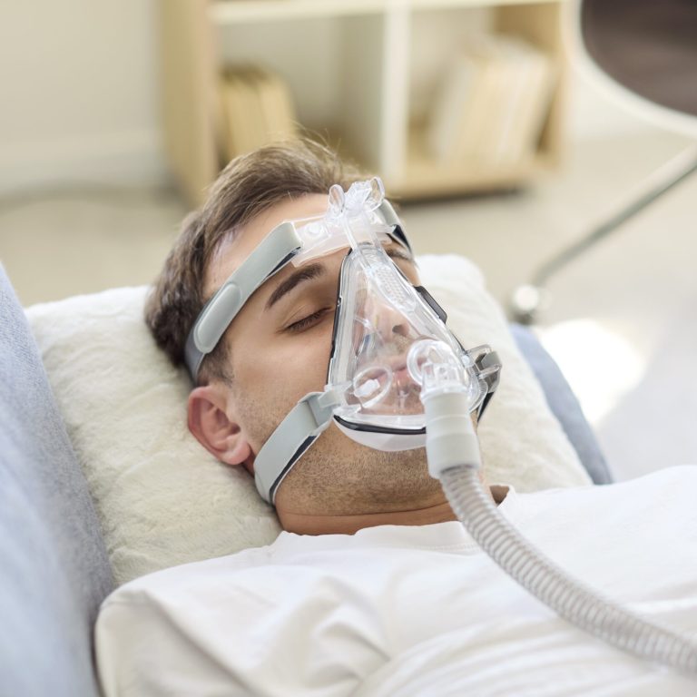 Man,In,Aspirator,With,Oxygen,Mask,Resting,In,Bed.,The